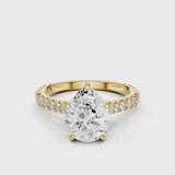 Hazel Pear lab diamon engagement ring with Cathedral shank and Single row French pave setting band video Yellow Gold