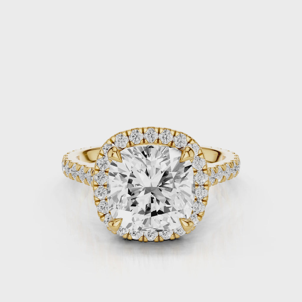Camellia Cushion Lab Created Diamond Engagement Ring with single seamless halo design. Cathedral with single row diamond French pave band video Yellow Gold
