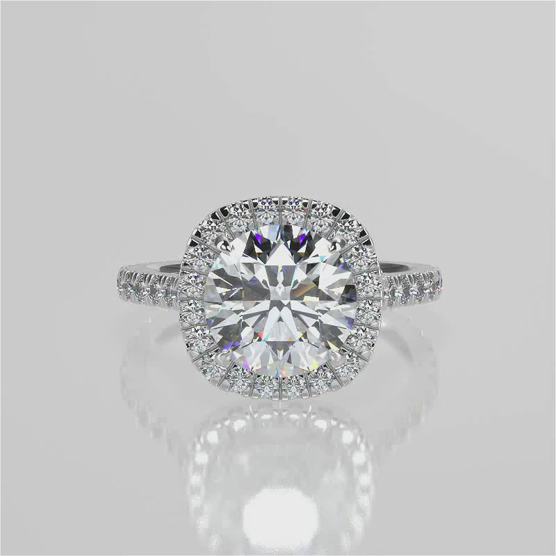 Mimosa Round cut lab diamond engagement ring with a cathedral setting and halo. French pave band video 
