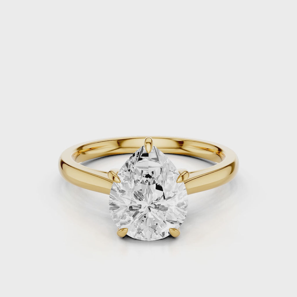 Thalia pear lab diamond engagement ring with Cathedral shank and plain tapered gold band video Yellow Gold