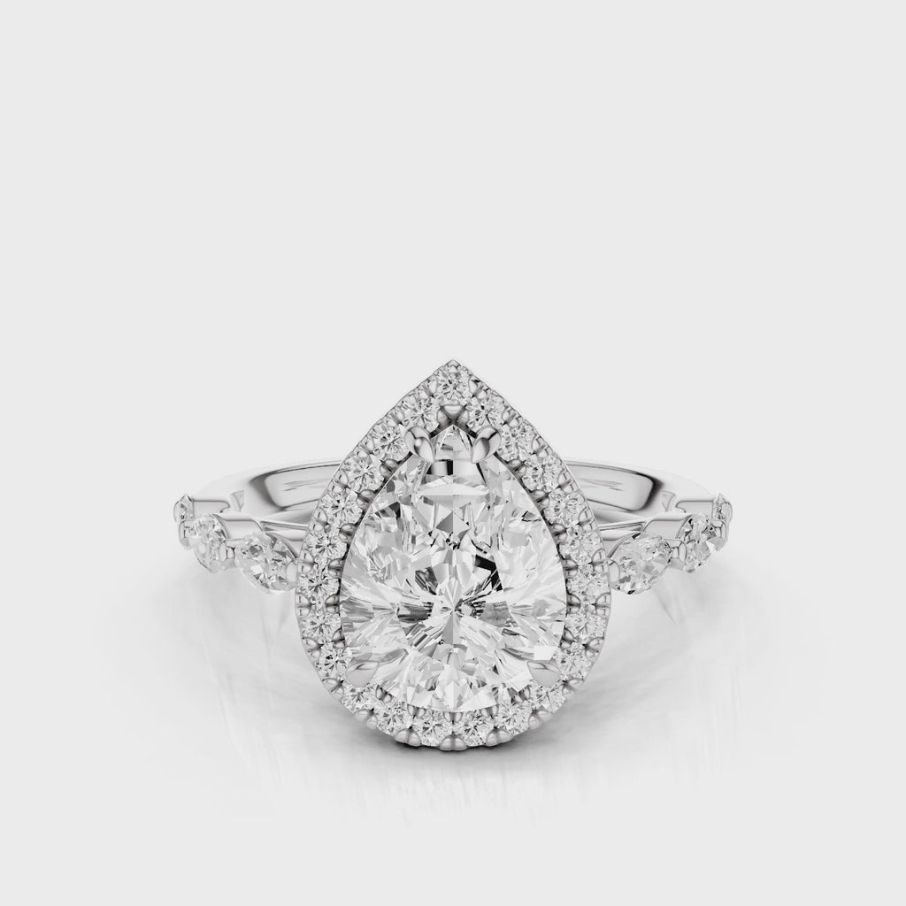 Eva Pear lab diamond engagement ring with cathedral shank and single seamless halo setting with the side marquise diamonds video White Gold