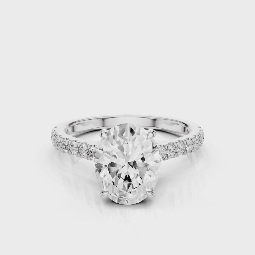 Dantella Oval lab diamond engagement ring with four prongs. Reverse seamless halo, cathedral, single row diamond band with floral basket design White Gold