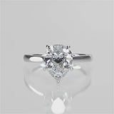 Thalia pear lab diamond engagement ring with Cathedral shank and plain tapered gold band video 