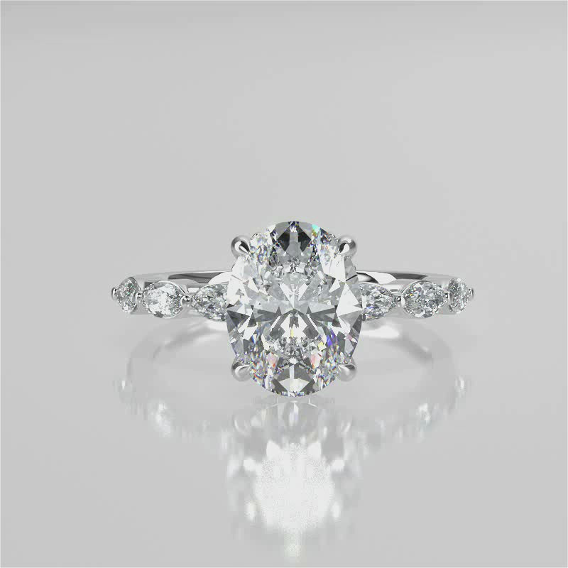 Stella Oval lab diamond engagement ring non-cathedral, diamond gallery setting
and 4 prongs. Marquise lab grown diamonds on band. 