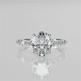 Stella Oval lab diamond engagement ring non-cathedral, diamond gallery setting
and 4 prongs. Marquise lab grown diamonds on band. 