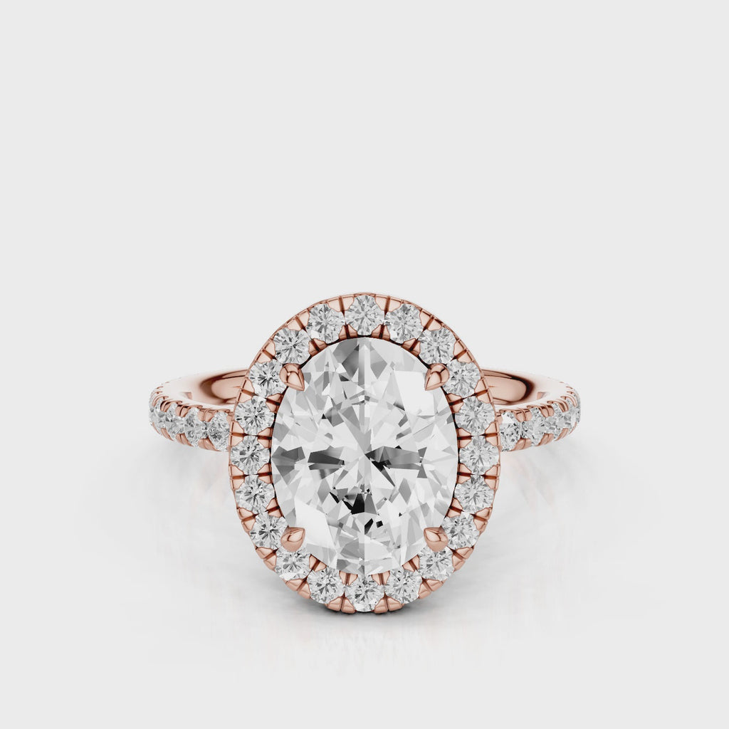 Raquel Oval lab diamond engagement ring. Non-cathedral, double edge seamless halo, single row French pave setting Rose Gold