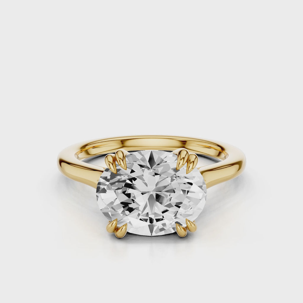Nailah Oval East West solitaire ring with claw prongs Yellow Gold