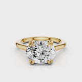 Nailah Oval East West solitaire ring with claw prongs Yellow Gold