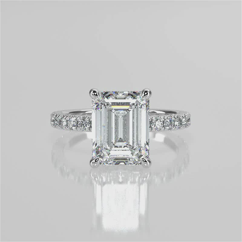 Mira Emerald lab diamond engagement ring. Non-cathedral shank, single row french pave setting band with a 4 prongs setting video 