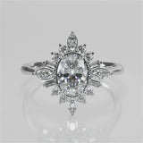 Lucidia Oval lab diamond engagement ring  with a plain band and accent stones. Mix of straight baquette, round and marquise lab-created diamonds