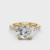 Nailah Oval lab diamond engagement ring in east west setting and tiger claw prongs and a french pave band video Yellow Gold