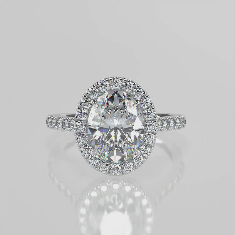 Orchid Oval lab diamond engagement ring with seamless halo, cathedral shank, single row French pave set band with floral under gallery design video 
