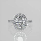 Orchid Oval lab diamond engagement ring with seamless halo, cathedral shank, single row French pave set band with floral under gallery design video 