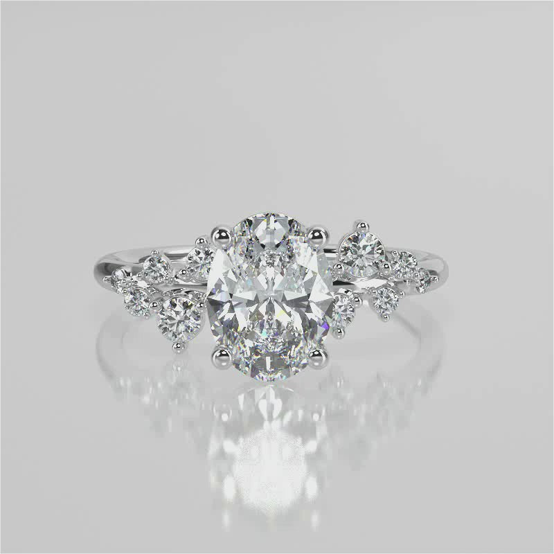 April Oval Lab diamond engagement ring with non cathedral setting and round accent stones