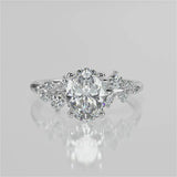 April Oval Lab diamond engagement ring with non cathedral setting and round accent stones